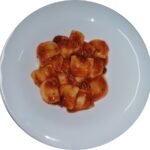 RAVIOLI IN BOLOGNESE SAUCE - half moon shape